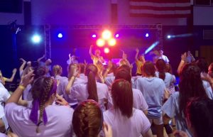 Students take part in the final line dance of mini-Thon at five o'clock in the morning. The line dance was led by the spirit and morale committee.