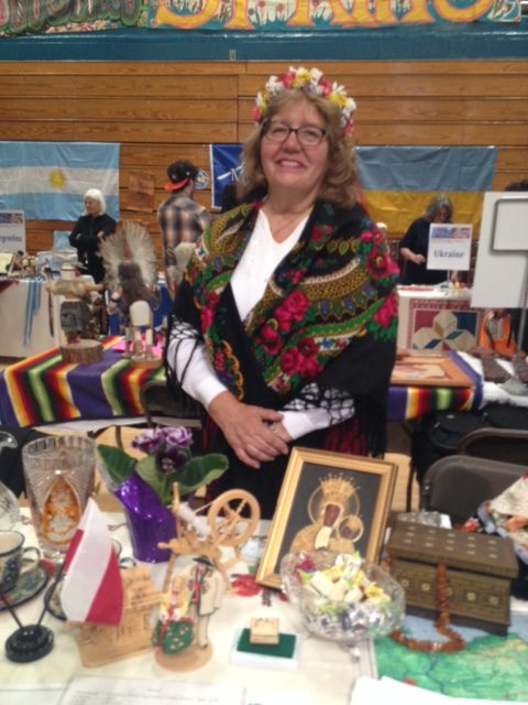 International Festival vendor Dina Bielawiec shows off her display of cultural items in the NPHS gym.