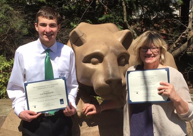 Carl Hamilton and AP English teacher Mrs. Ellen McKee pose with their awards next to the Nittany Lion Shrine at Penn State University. 