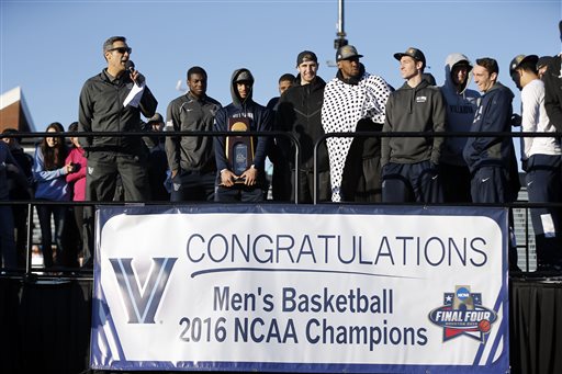 Villanova coach Jay Wright, left, speaks as he and the team celebrate with fans on the schools campus Tuesday, April 5, 2016, in Villanova, Pa. Villanova defeated North Carolina 77-74 to win the NCAA mens college basketball toiurnament Monday night in Houston. (AP Photo/Matt Rourke)