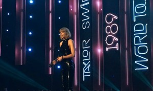 Taylor Swift accepts her award for Best Tour during Sunday's iHeartRadio music awards. 