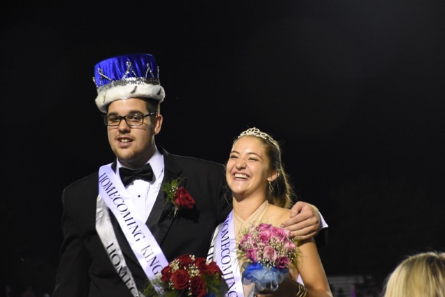 Ben Hartranft and Victoria Braeunle posing together for photos after being crowned the North Penn High School 2016 Homecoming king and queen.