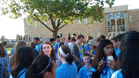 Students crowd and wait patiently around volunteer face painters at NPHSs pregame party on Friday, September 23rd to celebrate before the homecoming game.