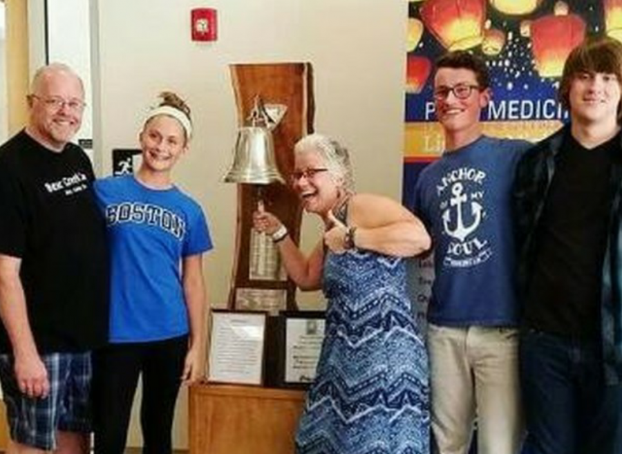 The Strobel Family pictured left to right: John Strobel, Rachel Strobel, Karen Strobel, Henry Strobel, Jack Strobel
Supported by her family, Karen Strobel is pictured ringing the bell that signified her breast cancer last treatment at Penn Medical Center, Valley Forge.
