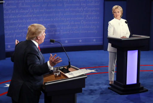 Democratic presidential nominee Hillary Clinton and Republican presidential nominee Donald Trump debate during the third presidential debate at UNLV in Las Vegas, Wednesday, Oct. 19, 2016. (Mark Ralston/Pool via AP)