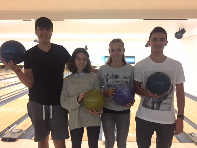 From left: Cem Hoffman, student from Salzgitter, Germany, Veronica Muñoz, student from Madrid, Spain, Karolina Weiland, student from Essingen, Germany, and Luc Bougeard, student from Bordeaux, France pose for a photo from a bowling outing organized by the International Friendship Club.
