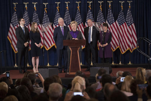 Democratic presidential candidate Hillary Clinton, accompanied by, from left, son-in-law Marc Mezvinsky, daughter Chelsea Clinton, husband, former President Bill Clinton, vice presidential candidate, Sen. Tim Kaine, D-Va., and his wife Anne Holton, speaks in New York, Wednesday, Nov. 9, 2016. Clinton conceded the presidency to Donald Trump in a phone call early Wednesday morning, a stunning end to a campaign that appeared poised right up until Election Day to make her the first woman elected U.S. president. (AP Photo/Matt Rourke)