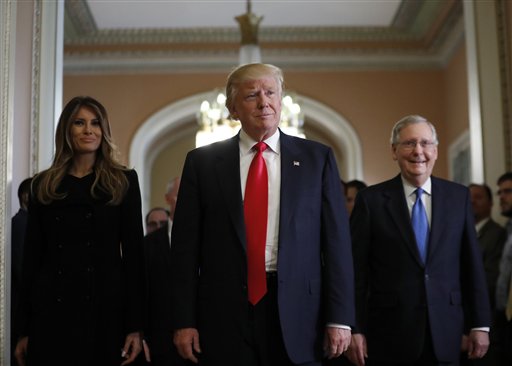 Melania Trump, and her husband President-elect Donald Trump, center, walk with Senate Majority Leader Mitch McConnell, of Kentucky, as they depart after a meeting on Capitol Hill, Thursday, Nov. 10, 2016 in Washington. (AP Photo/Alex Brandon)