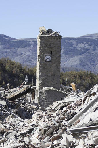 The bell tower of Amatrice, central Italy, which stood standing after the Aug. 24, 2016 earthquake, is seen with its top part collapsed after an earthquake with a preliminary magnitude of 6.6 struck central Italy, Sunday, Oct. 30, 2016. A powerful earthquake rocked the same area of central and southern Italy hit by quake in August and a pair of aftershocks last week, sending already quake-damaged buildings crumbling after a week of temblors that have left thousands homeless. (Massimo Percossi/ANSA via AP)