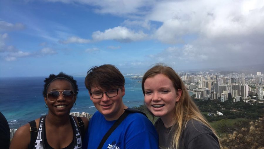 From left: Daelin Brown, Stephen Hammond, and Julie Landes stopped to take a photo at the top of the Diamond Head Volcano.