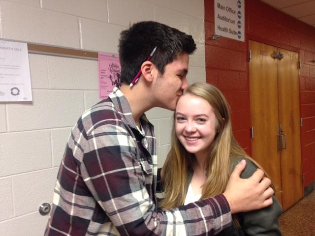 Steven Kendikian, junior at NPHS, gives a friendly kiss to Olivia Kriwasch. With a positive attitude and smile on his face, Kendikian walks the halls of NPHS brightening his peers day.