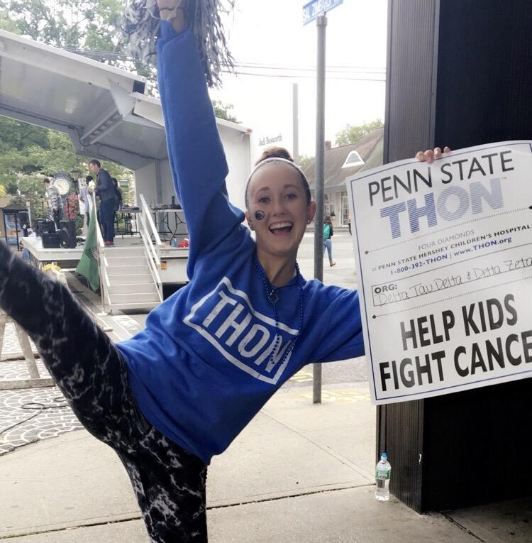 Madi Peyton, a NP alum, poses for a photo while canning for Penn State Universitys THON. 