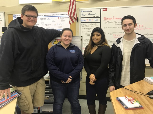 Miss Julia Young, a new addition to the engineering department at NPHS, currently teaches First Level Manufacturing, Advanced Manufacturing, and Digital Electronics classes. In the above photo, she poses with three of her students that are currently working on a circuit board. 