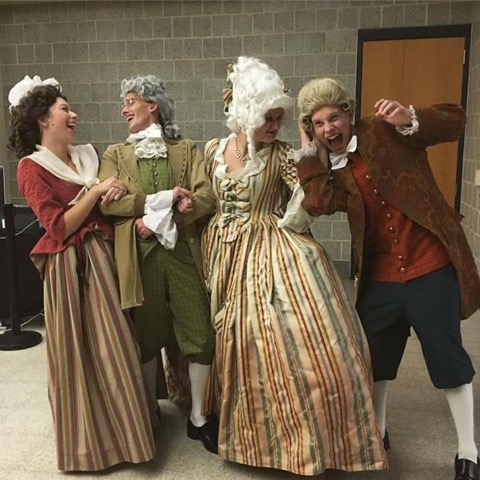 Francis Burk, second from the left, poses for a photo with his fellow actors after the fall play, She Stoops to Conquer. 