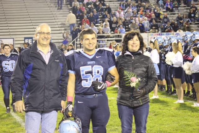Zach LaValla with his parents at North Penns senior night game earlier this season