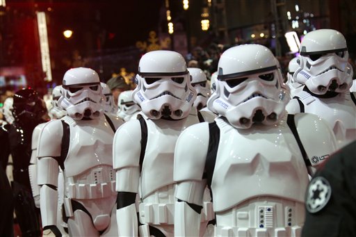 People dressed as stormtroopers walk on the red carpet upon arrival at the European premiere of the film Star Wars: The Force Awakens  in London, Wednesday, Dec. 16, 2015. (Photo by Joel Ryan/Invision/AP)
