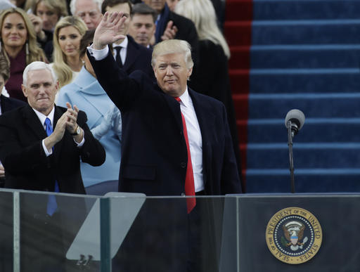 Vice President Mike Pence, left, applauds as President Donald Trump waves after delivering his inaugural address after being sworn in as the 45th president of the United States during the 58th Presidential Inauguration at the U.S. Capitol in Washington, Friday, Jan. 20, 2017. (AP Photo/Patrick Semansky)