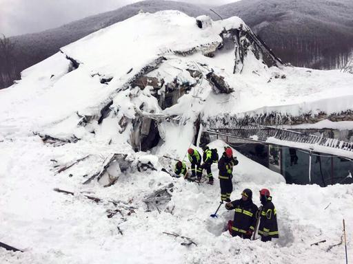 Italian firefighters search for survivors after an avalanche buried a hotel near Farindola, central Italy, Thursday, Jan. 19, 2017. Rescue workers on skis reached a four-star spa hotel buried by an avalanche in earthquake-stricken central Italy Thursday, reporting no signs of life as they searched for around 30 people believed trapped inside.  (Italian Firefighters/ANSA via Italian Firefighters)
