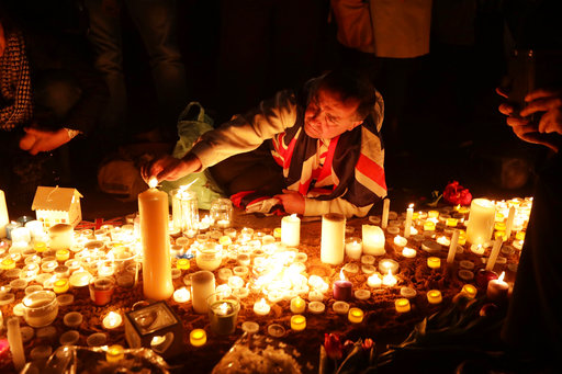 People light candles at a vigil for the victims of Wednesdays attack, at Trafalgar Square in London, Thursday, March 23, 2017. The Islamic State group has claimed responsibility for an attack by a man who plowed an SUV into pedestrians and then stabbed a police officer to death on the grounds of Britains Parliament. Mayor Sadiq Khan called for Londoners to attend a candlelit vigil at Trafalgar Square on Thursday evening in solidarity with the victims and their families and to show that London remains united. (AP Photo/Matt Dunham)