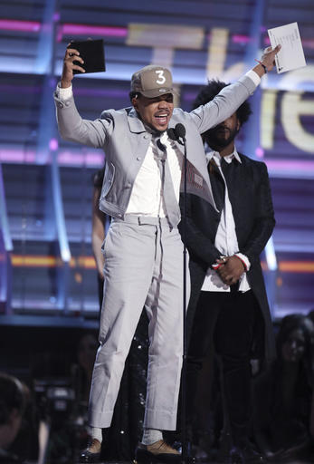 Chance The Rapper accepts the award for best rap album for Coloring Book at the 59th annual Grammy Awards on Sunday, Feb. 12, 2017, in Los Angeles. (Photo by Matt Sayles/Invision/AP)