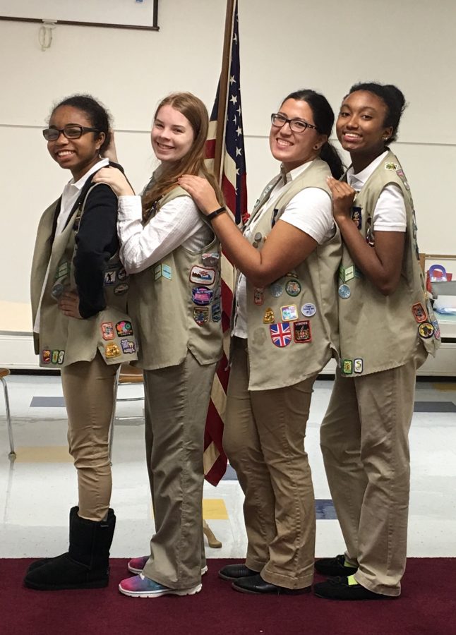 Lauren+Wolfe%2C+second+from+left%2C+stands+with+three+of+her+friends+from+Girl+Scouts.