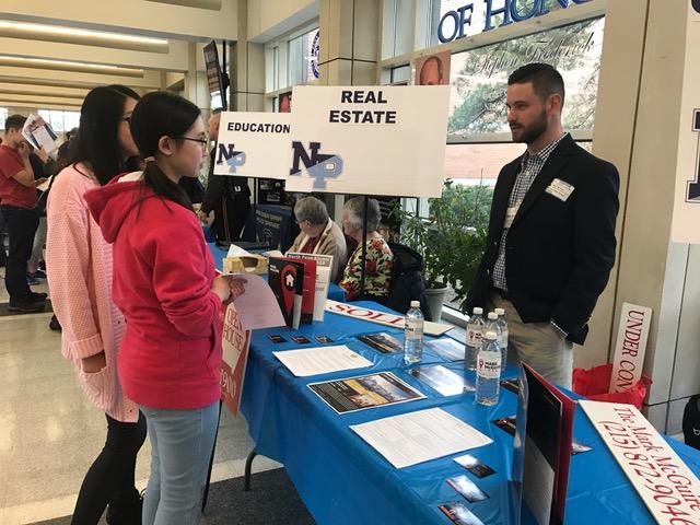 Mark McGuire, a NP alum, speaks with students about real estate at Tuesdays Next Steps college and career fair.