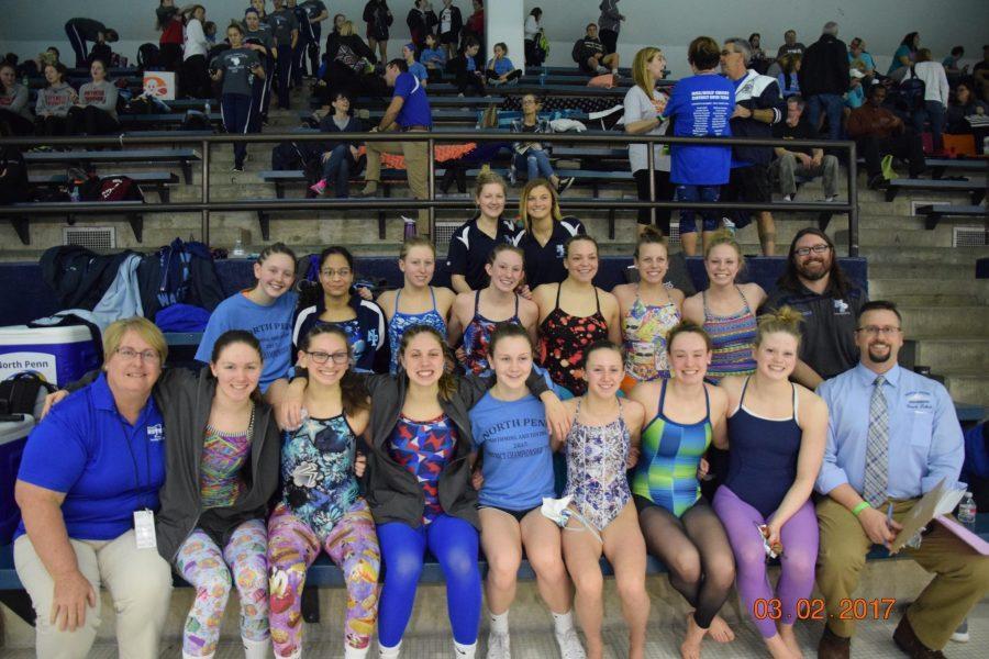 The girls swim team gather for a picture