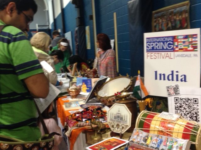 A+community+member+stops+by+a+table+dedicated+to+India+at+the+International+SPring+Festival.