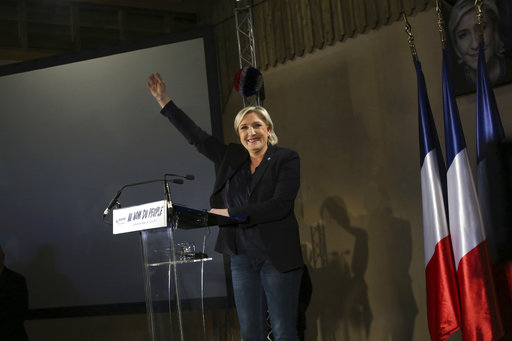 Far-right candidate for the presidential election Marine Le Pen waves to supporters at the end of her speech during a meeting in La Bazoche Gouet, central France, Monday, April 3, 2017. A self-described patriot, Le Pen hopes to extract France from the European Union and do away with Frances membership in the shared euro currency. (AP Photo/Thibault Camus)