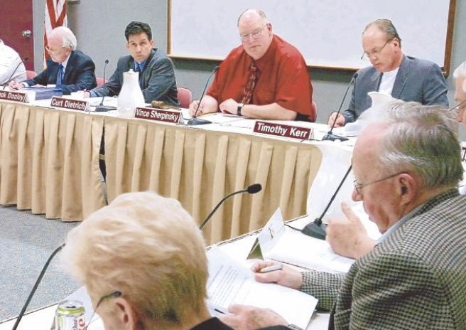  North Penn School Board President Vince Sherpinsky, top center, and the rest of the school board discuss an issue during Thursday nights meeting. 