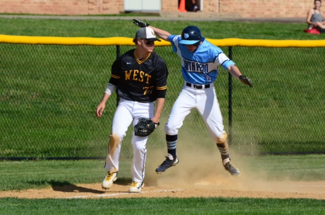 BEALS ON WHEELS: Junior Ryan Bealer slides safely into third in the Knights 9-5 win over CB West on Tuesday.