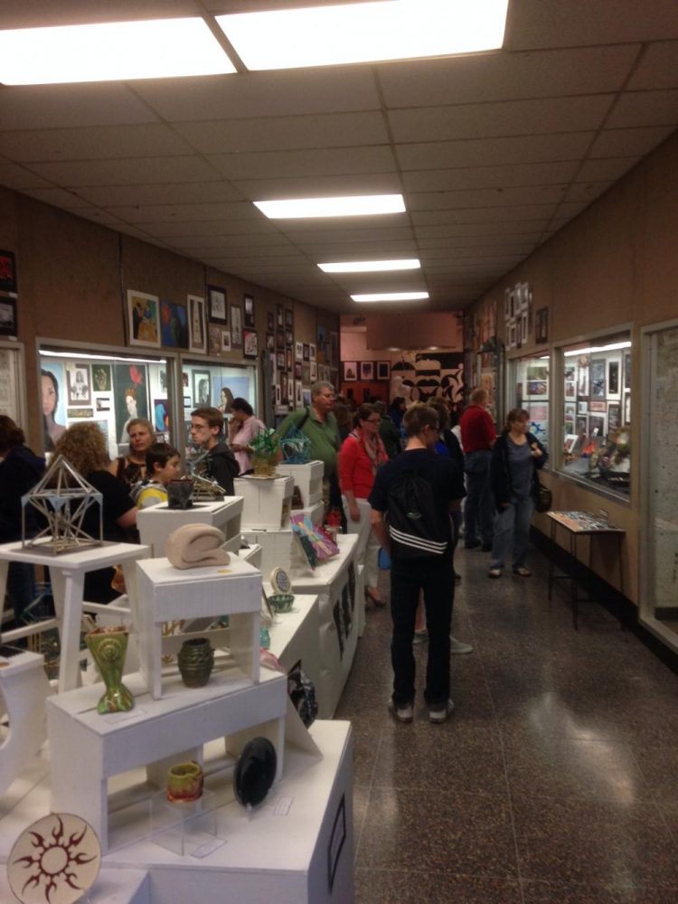 Visitors admire the artwork of various students at the annual art show at NPHS last year.