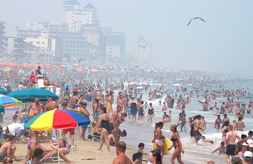 Visitors crowd the beaches of Ocean City, Md., Thursday, July 4, 2002, while visiting visiting the resort for the July Fourth holiday. (AP Photo/Stephen Cherry)