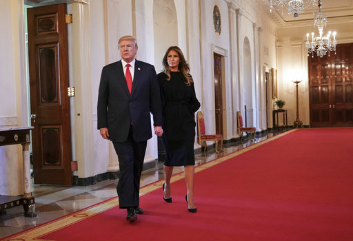 President Donald Trump and first lady Melania Trump walk in to speak on combatting drug demand and the opioid crisis in the East Room of the White House in Washington, Thursday, Oct. 26, 2017. (AP Photo/Pablo Martinez Monsivais)