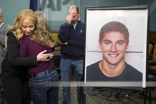 Jim and Evelyn Piazza pictured embracing Centre County District Attorney, Stacy Parks Miller, during a news press conference concluding the results of the investigation on their son, Timothy Piazzas, death.