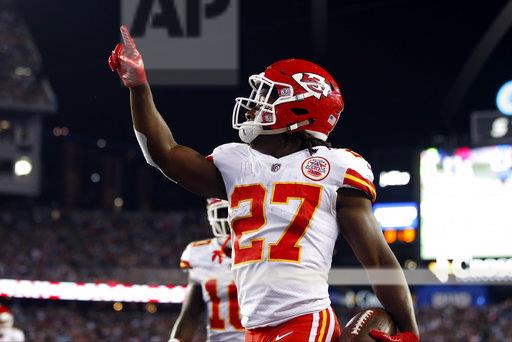 Kansas City Chiefs running back Kareem Hunt (27) celebrates his touchdown against the New England Patriots during the first half of an NFL football game, Thursday, Sept. 7, 2017, in Foxborough, Mass. (AP Photo/Michael Dwyer)