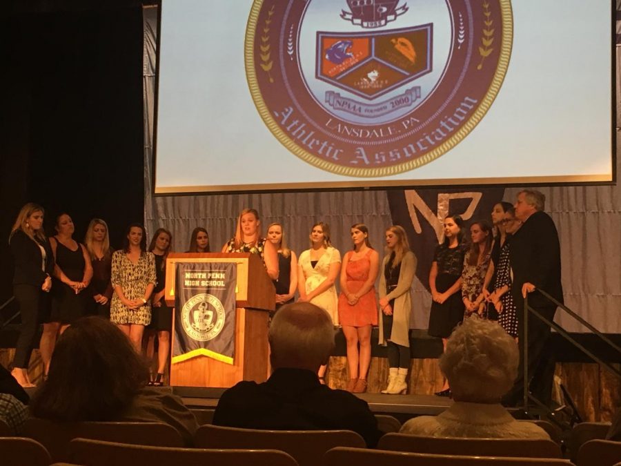 Member of the 2008 and 2009 North Penn Girls Water Polo team, Colleen Stiles, speaks on behalf of the two teams at the induction ceremony