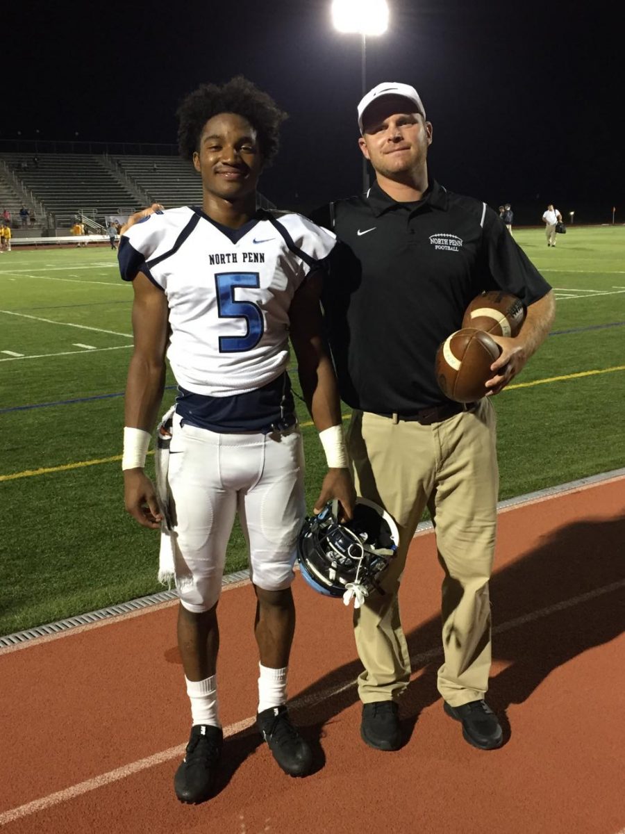 Justis Henley and coach Kevin Zebliun pose after winning 45-35 against Pennridge High School