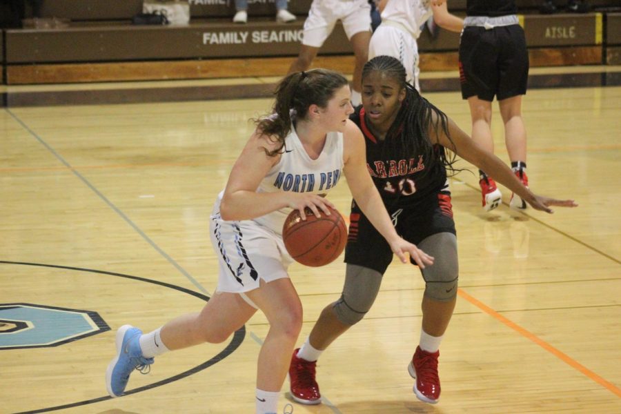 BASKETBALL- Bri Hewlett speeds past Archbishop Carroll. Hewlett is one of North Penns two returning starters.