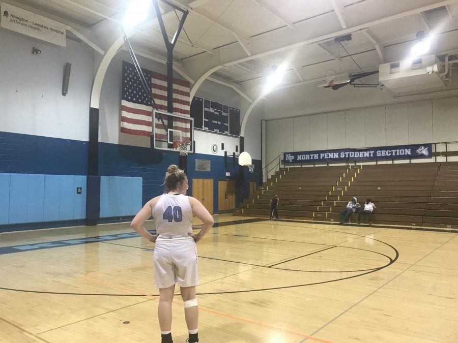 BASKETBALL- Senior Jess McKenzie reflects on the court after her teams twelfth loss in a row.