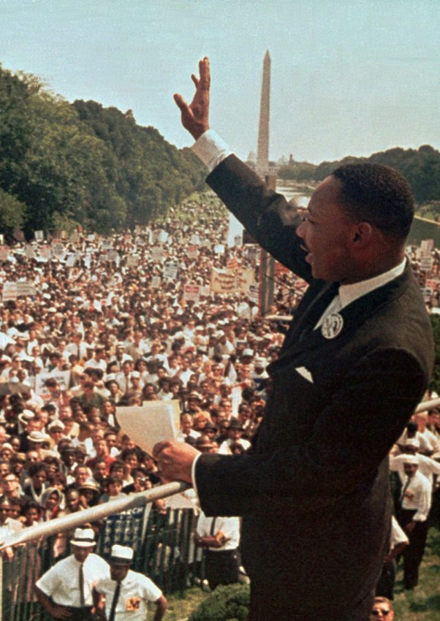 FILE – The Rev. Martin Luther King Jr. waves to the crowd at the Lincoln Memorial on Aug. 28, 1963. (AP Photo/File)