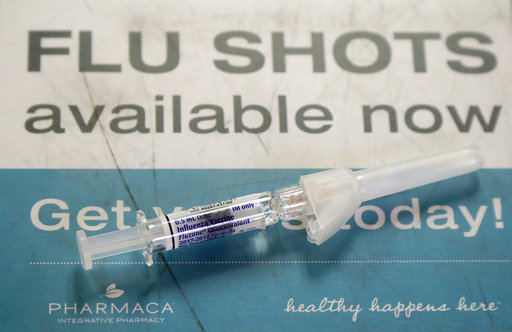 A Fluzone influenza vaccine is shown at Pharmaca Integrative Pharmacy in San Francisco, Tuesday, Jan. 9, 2018. Flu-related deaths in California are higher than usual so far this season and most victims were not vaccinated, state health officials said Tuesday in urging residents to get flu shots. (AP Photo/Jeff Chiu)