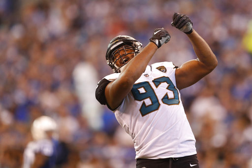 This Oct. 22, 2017, file photo shows Jacksonville Jaguars defensive end Calais Campbell (93) celebrating a sack against the Indianapolis Colts during the second half of an NFL football game in Indianapolis. Campbell has two things he wants to bring back from Arizona: An eighth victory and Larry Fitzgeralds No. 11 jersey. One is much more important to him than the other. Campbell will return to the place where he spent the previous nine seasons when the Jacksonville Jaguars (7-3) play the Cardinals (4-6) on Sunday, Nov. 26, 2017.   (AP Photo/Jeff Roberson, File)