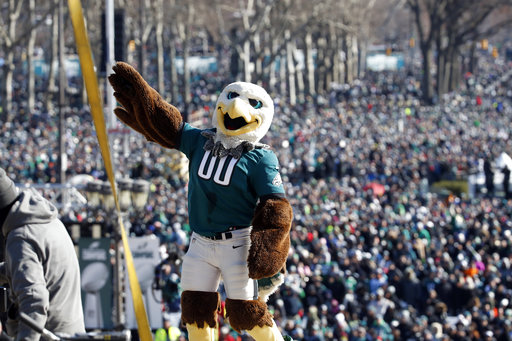 Philadelphia Eagles mascot Swoop reacts with the fans behind him in front of the the Philadelphia Museum of Art after a Super Bowl victory parade for the Philadelphia Eagles football team, Thursday, Feb. 8, 2018, in Philadelphia. The Eagles beat the New England Patriots 41-33 in Super Bowl 52. (AP Photo/Alex Brandon)