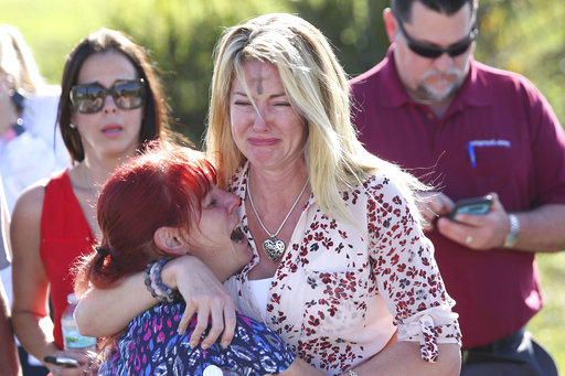 Parents+wait+for+news+after+a+reports+of+a+shooting+at+Marjory+Stoneman+Douglas+High+School+in+Parkland%2C+Fla.%2C+on+Wednesday%2C+Feb.+14%2C+2018.+%28AP+Photo%2FJoel+Auerbach%29