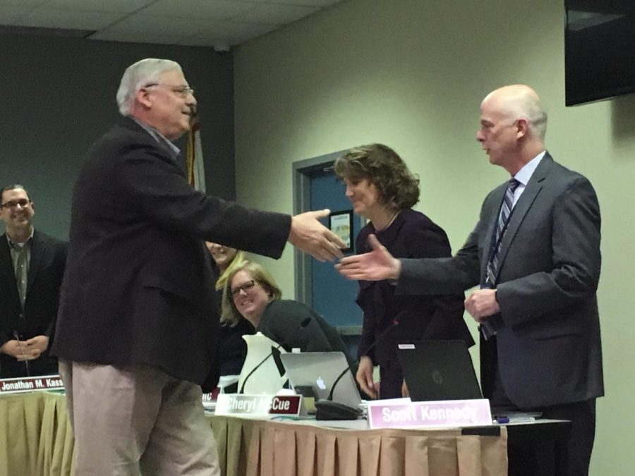 School+Board+awards+longtime+member+John+Schilling+with+a+plaque+to+commemorate+his+service.+