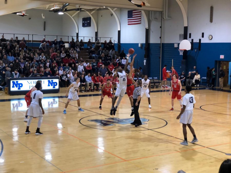 BASKETBALL- David Robinson jumps for the ball ti kick off the Knights game against the Souderton Indians.