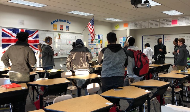 Students stand for the pledge during a first period English class at North Penn High School.