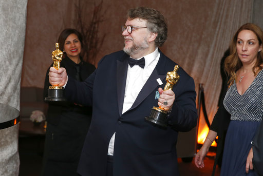 Guillermo del Toro poses with his awards for best director and best picture for The Shape of Water at the Governors Ball after the Oscars on Sunday, March 4, 2018, at the Dolby Theatre in Los Angeles. (Photo by Eric Jamison/Invision/AP)