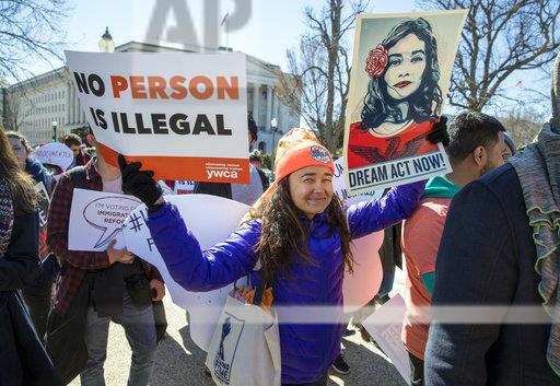 DACA recipients and other young immigrants march with supporters as they arrive at the Capitol in Washington, Monday, March 5, 2018. The program that temporarily shields hundreds of thousands of young people from deportation was scheduled to end Monday by order of President Donald Trump but court orders have forced the Trump administration to keep issuing renewals, easing the sense of urgency.  (AP Photo/J. Scott Applewhite)